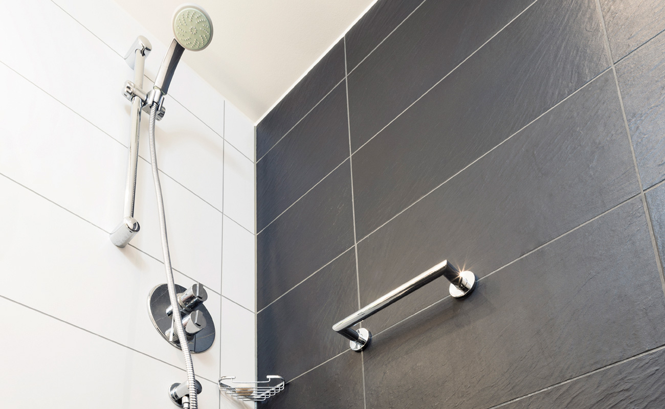 Water efficient rated showerhead in bathroom
