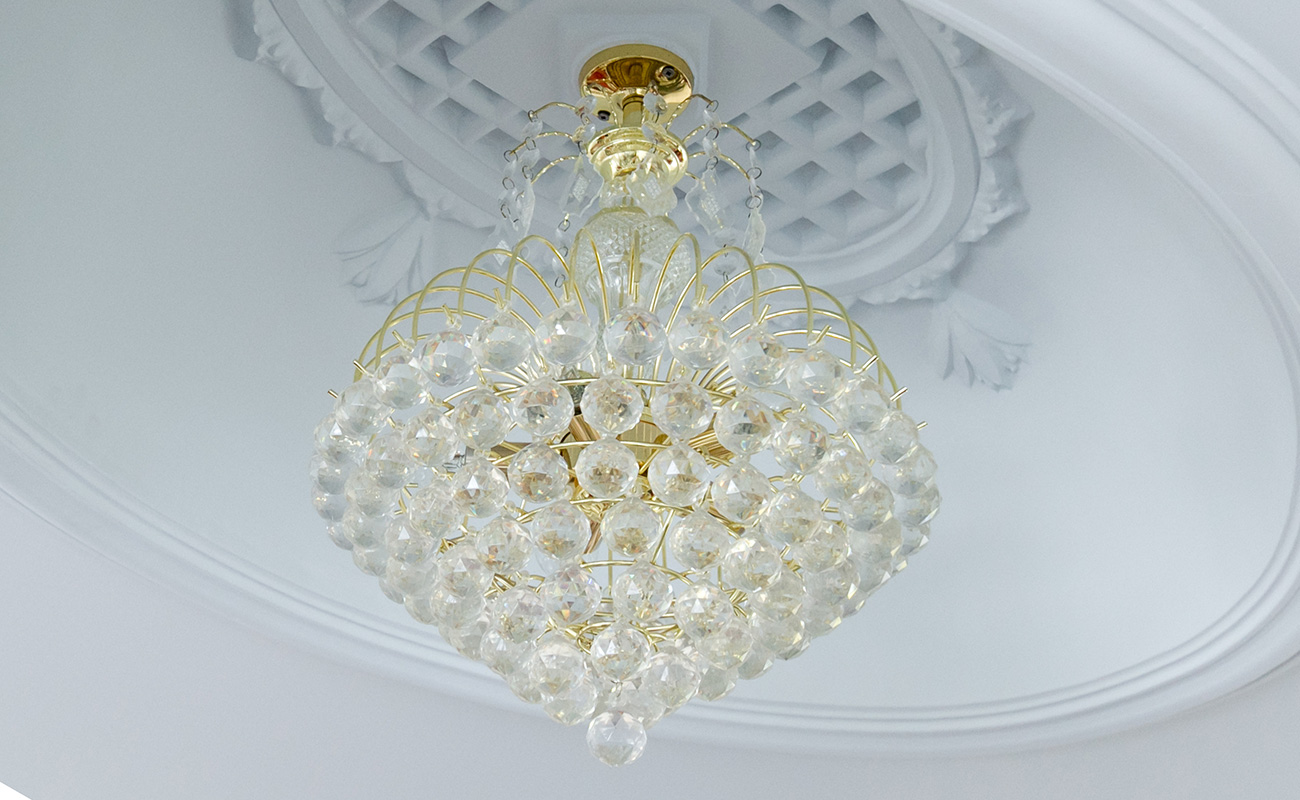 Designer, custom built crystal chandlier with gold framework.