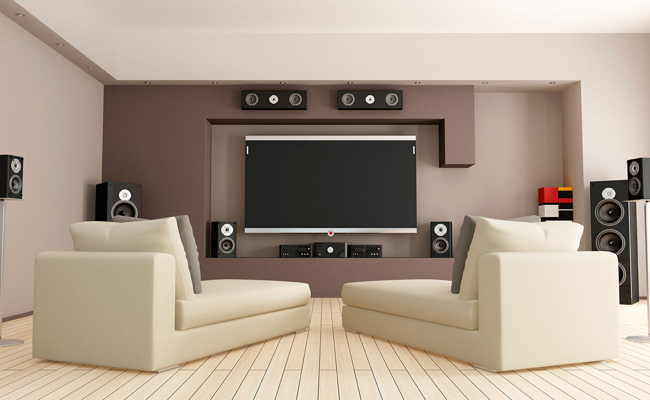 Top end home theatre room with latest flatscreen television and state of the art surround sound.