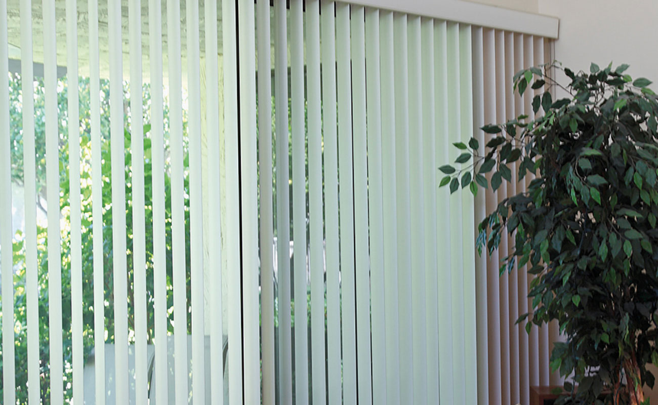 Vertical blind window dressing options create an illusion of heightened space