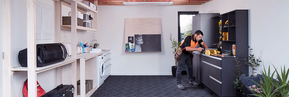 A garage with carefully planned storage and workspace