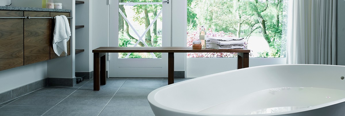 bathroom with grey tiles flooring