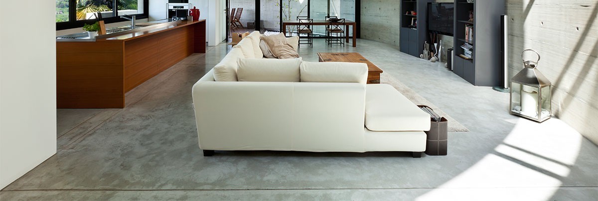 Concrete flooring in living room.