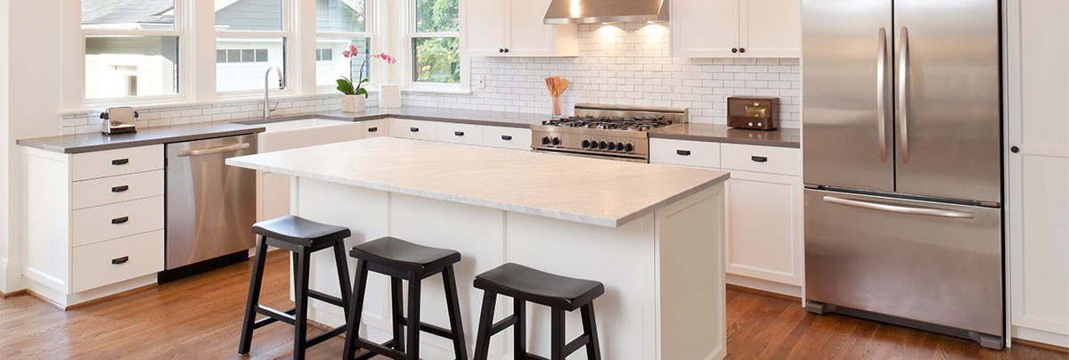 Kitchen renovation with floating island bench and subway tiles