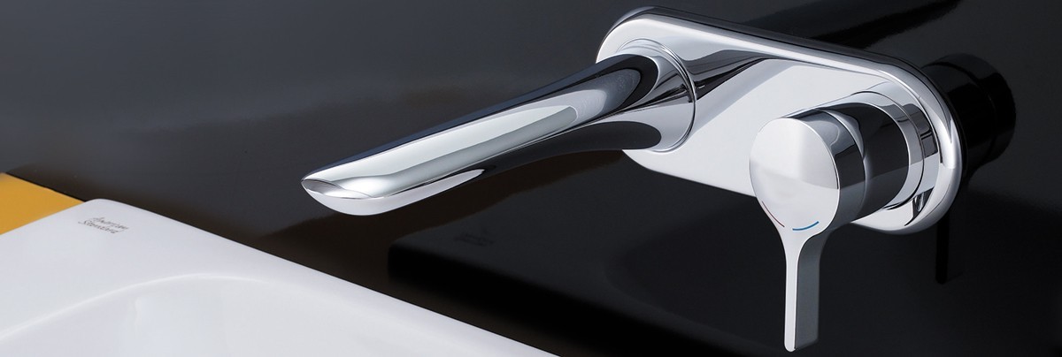 Silver tap and concealed wall mount base for bathroom sink.