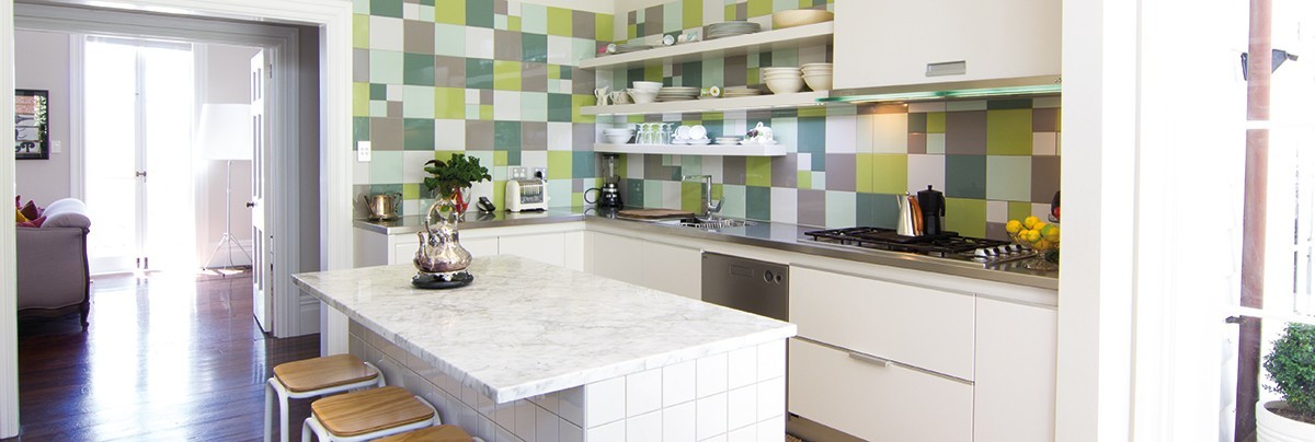 An open kitchen in Parnell with colourful tiles decoration