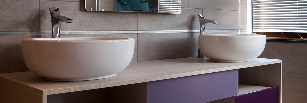 Double sink with purple finished vanity