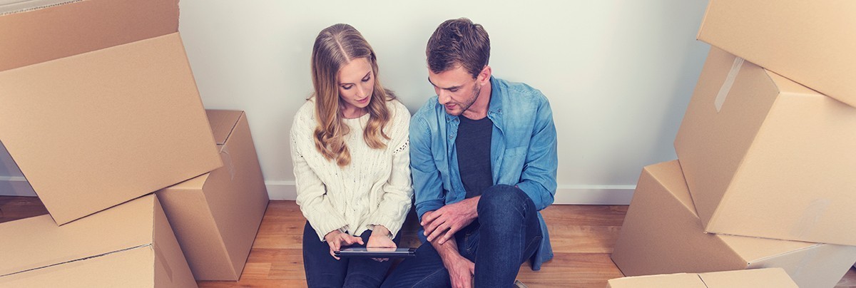 Couple moving in to rental house and looking up renovation options online