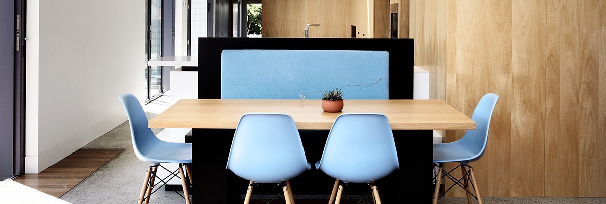 Blue chairs and wooden table