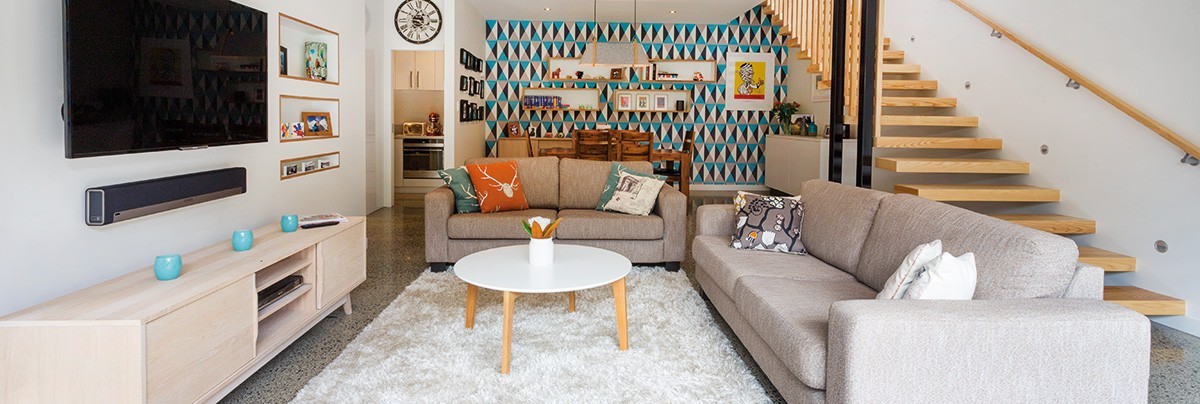 A renovate living room with cream rug