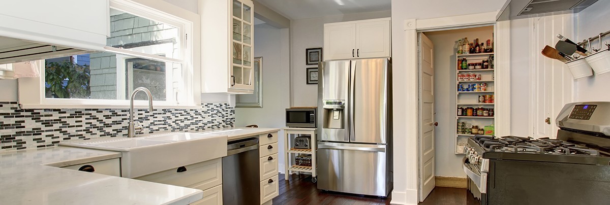 a kitchen with build in storage