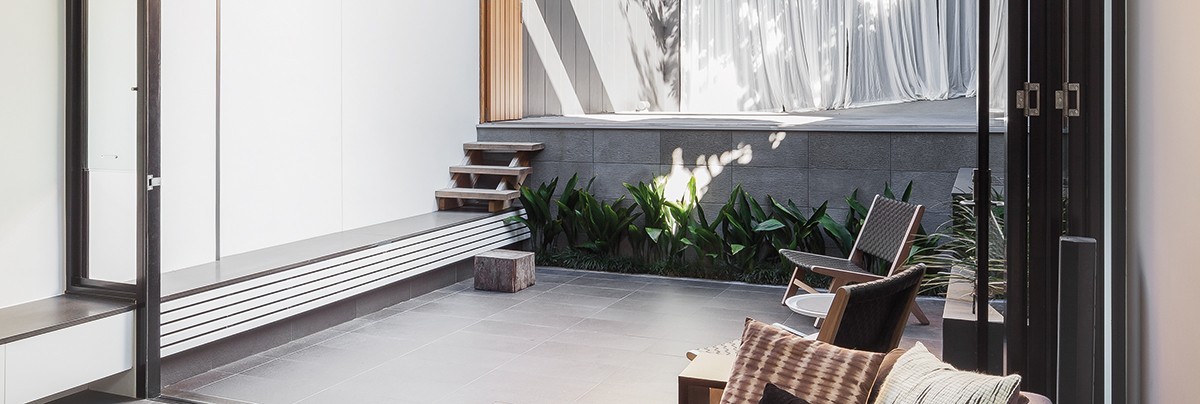 living room with a couch and outdoor space