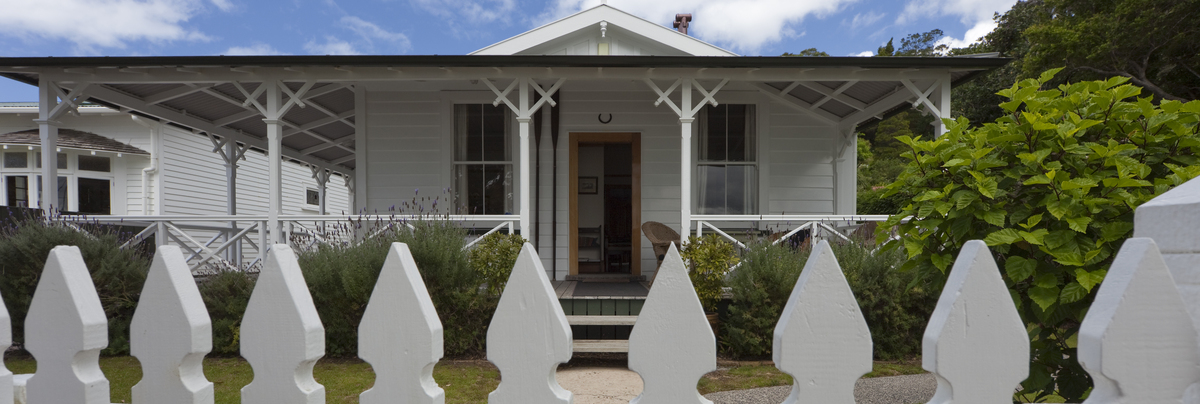 New Zealand house with white picket fence