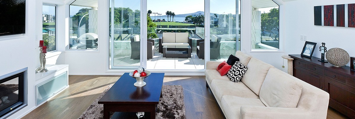 Modernised, open-plan apartment living room with fireplace