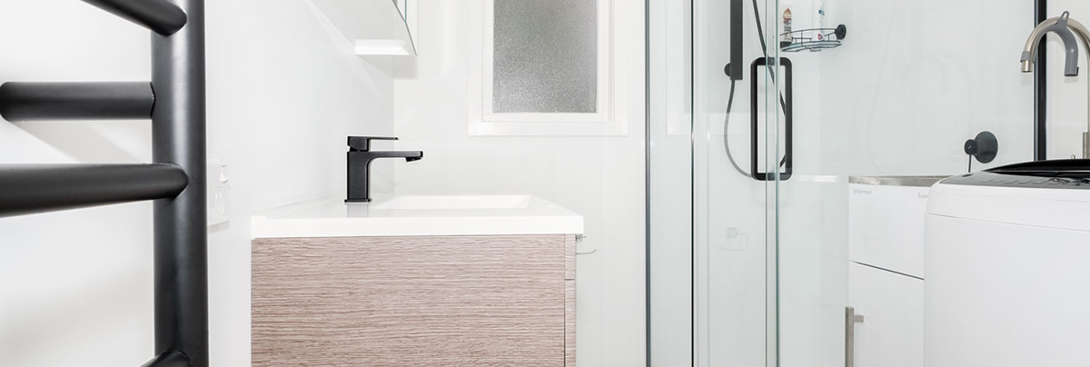 While modern upgrades create a fresh look, removing the old shower-over-bath made all the difference in this bathroom renovation, creating space.