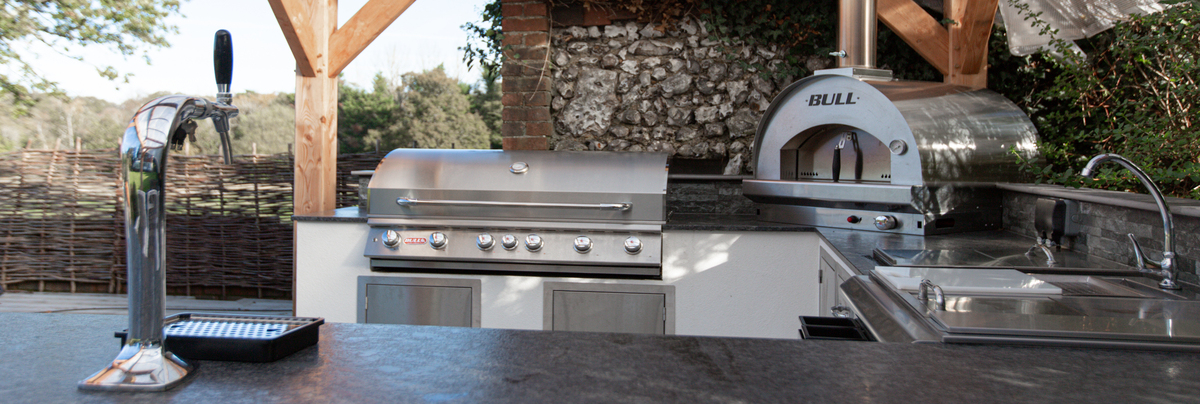 A view from the side of the outdoor kitchen showing the appliances