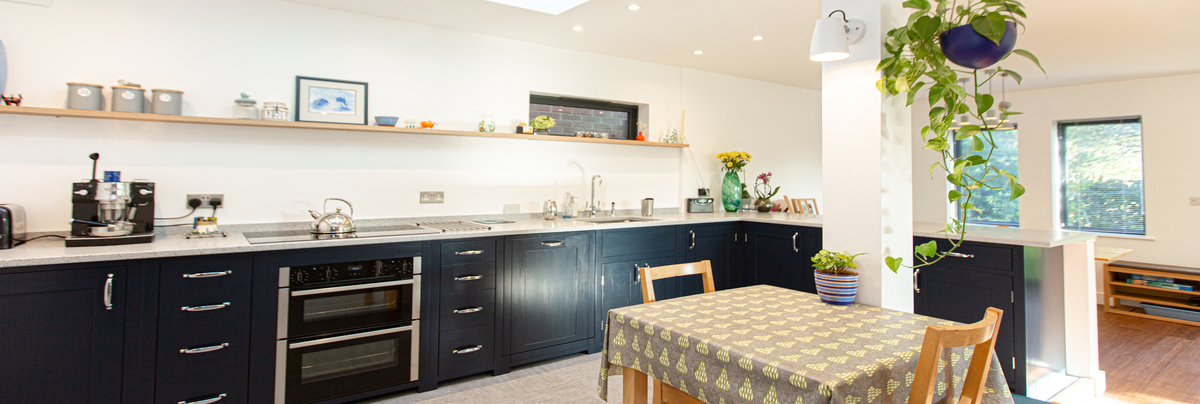 A large open plan kitchen and living area that overlooks the garden