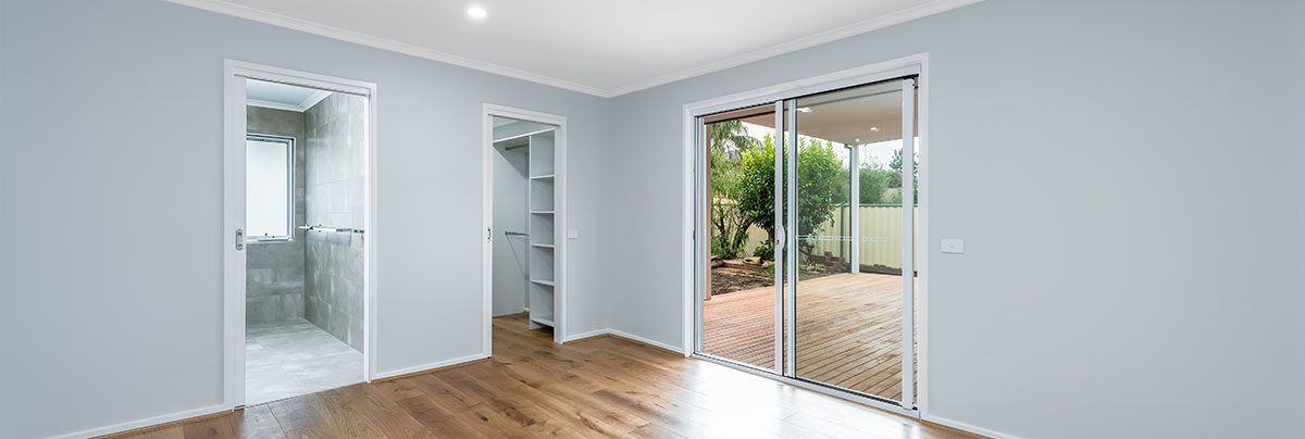 apartment renovation with a new open plan layout. New bathroom and renovated bedroom