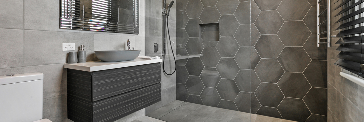 luxury bathroom with grey hexagon tiles