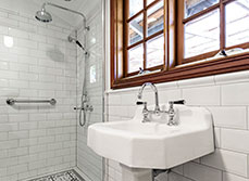 Bathroom renovation with tiles and wood in Perth, Australia.