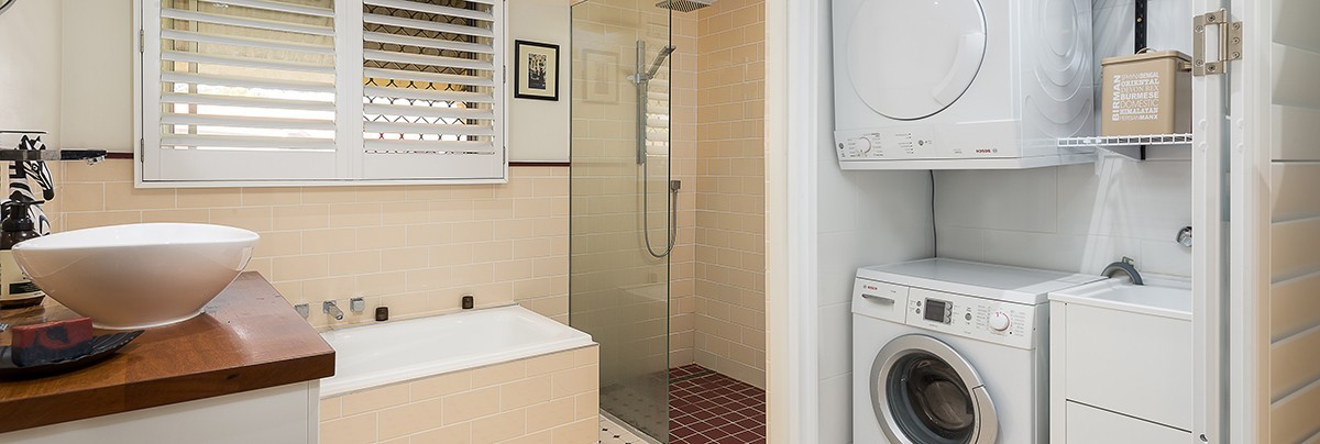 A new bathroom with extra laundry space