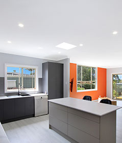 Cluttered weatherboard home to an exciting open plan space in Corrimal, NSW