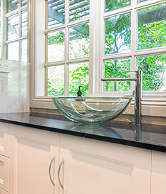 Custom-made vanity cabinet and a floral decoration