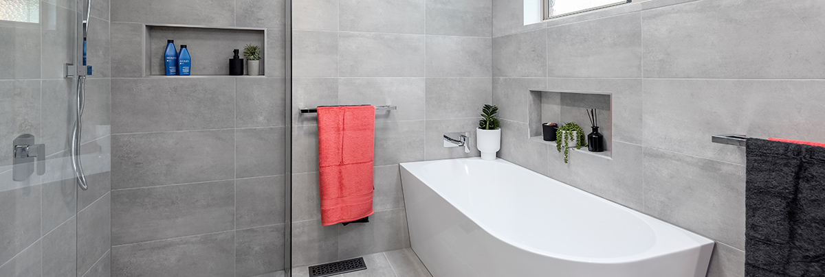 From bog-standard to sleek and modern, this property's bathroom and laundry room underwent a surprising transformation.