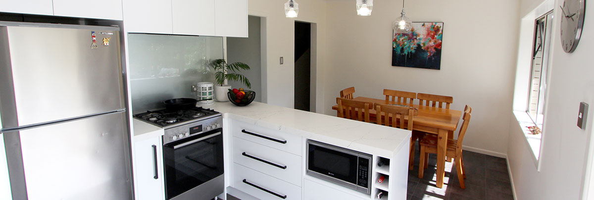 This modern bathroom and kitchen renovation was achieved under time and under budget! Find out how!