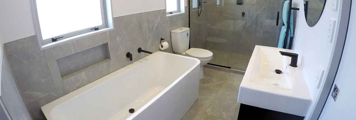 A combined bathroom, toilet and laundry in Palmerston North