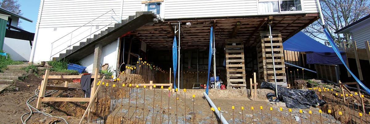 Dirt removed from underneath home to flatten out the slopped area.