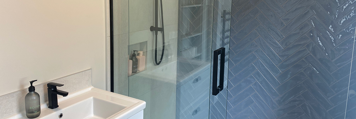 The bathroom of this 1920s beachfront villa has completely transformed with a new layout and oceanic design.
