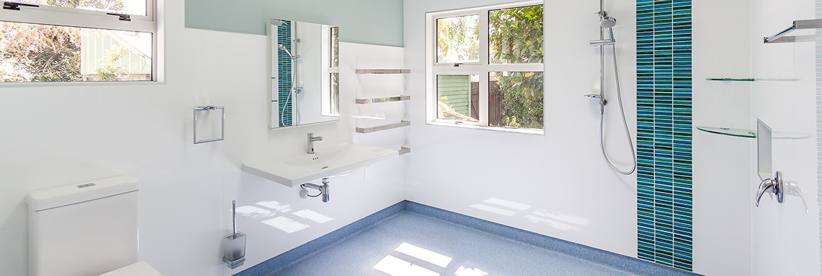 Modern bathroom with plenty of space for a wheelchair to move around
