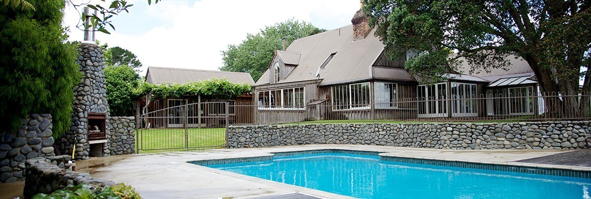 the overview of country ranch home with outdoor pool