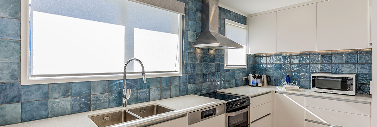 A concealed laundry lent space to the open-plan kitchen.
