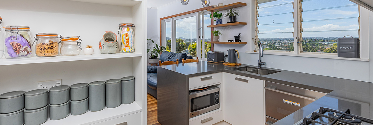Contemporary designs, modern appliances, and a consistent colour palette breathed new life into the kitchen, laundry, and bathroom of this b