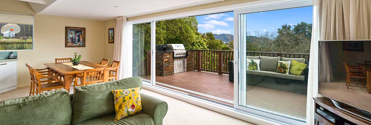 Renovated deck with a built in barbaque creating a smooth indoor to outdoor flow in wellington