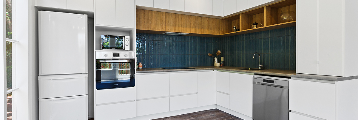 To prepare their Wellington bungalow for rent, these homeowners chose to modernise their property's kitchen, bathroom, and living room.