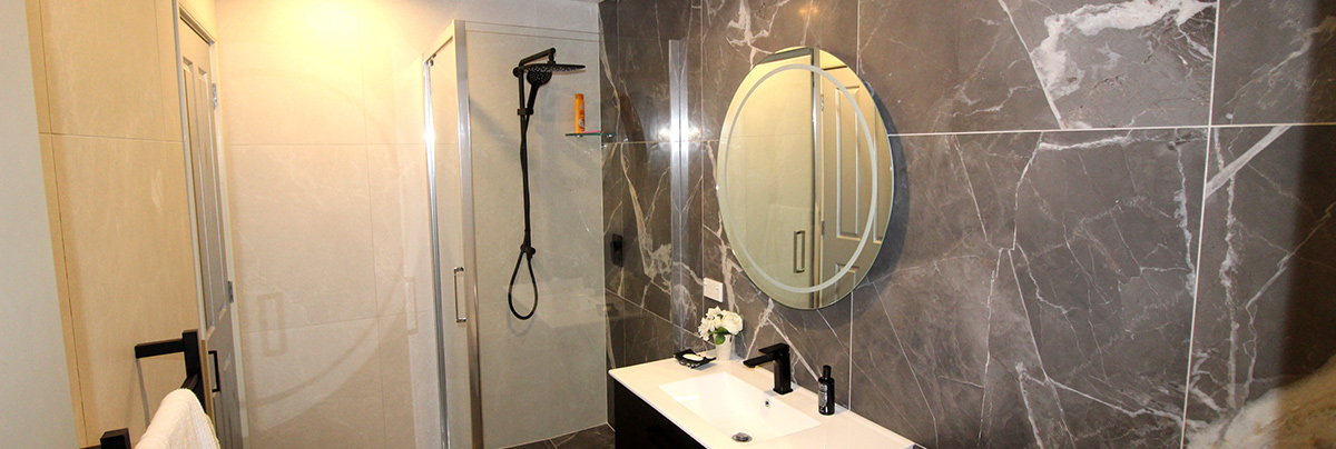 What were once dated bathrooms have become luxurious, open spaces for modern-day living.