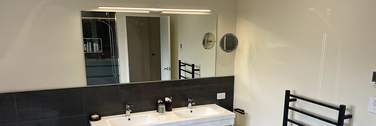 Strategic design and a monochromatic colour palette transformed this bathroom into a modern sanctuary.
