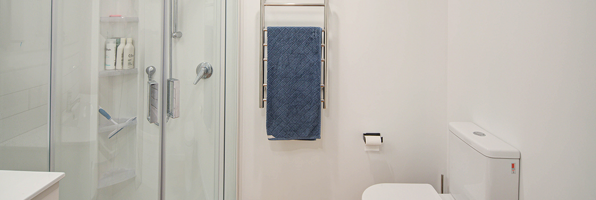 Functional and fresh, the new designs for this property's bathrooms and laundry room have provided smarter layouts with a clean look.