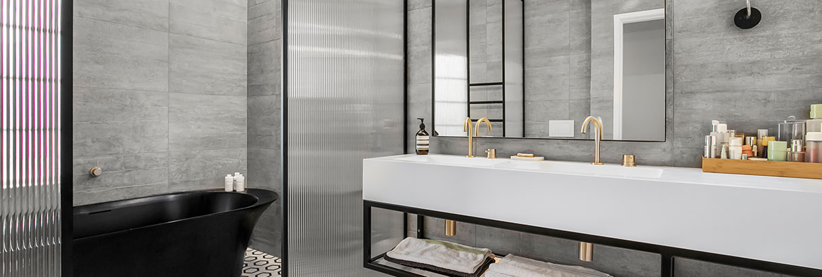 Bathroom renovation to a modern, grey scale design in an Auckland home.