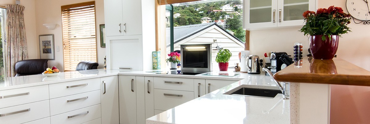 A renovate kitchen with white kitchen countertop