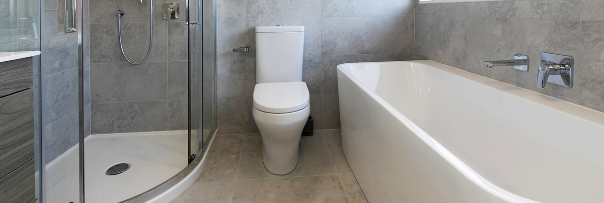 Modern bathroom with corner shower and freestanding bathtub