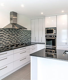 A renovated kitchen layout allows for more open space, due to a different orientation of the kitchen island bench.