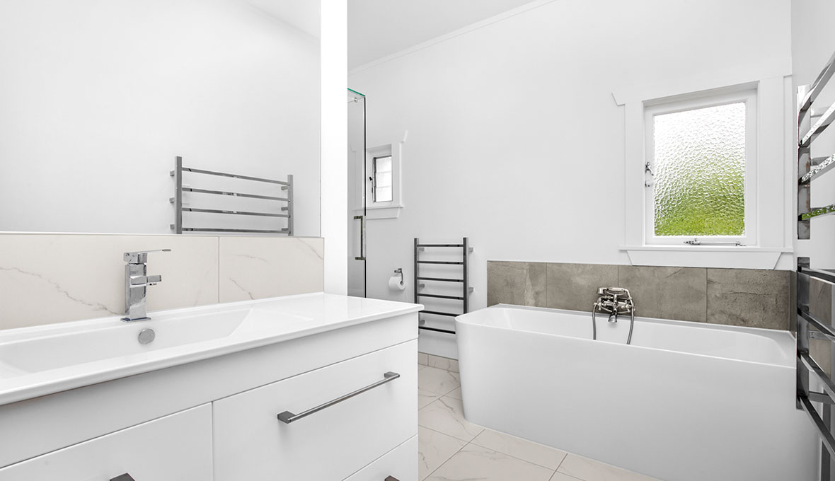 Renovated bathroom with bathtub in Remuera, Auckland by Chiraag at Refresh Renovations