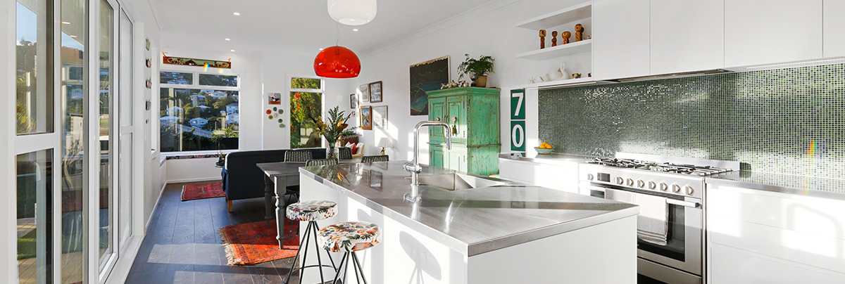 With a reconfigured layout for open-plan living, extended space for a larger kitchen and bathroom, and fresh interiors, this Island Bay villa