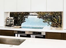 Bay view between trees graphic splashback