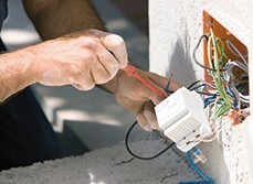 Certified electrician wiring new outlets.