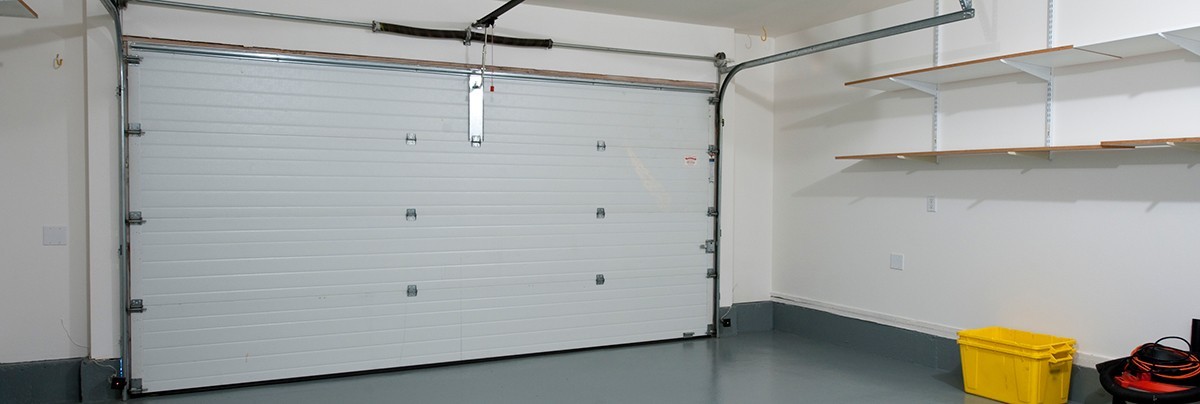 Basic garage renovation with painted floors and basic shelving